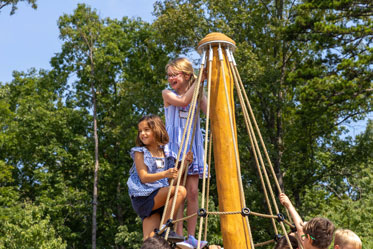 Two girls climb to the top of the mast of a playground ship. Links to Gifts by Estate Note Two girls climb to the top of the mast of a playground ship. Links to Gifts by Estate Note