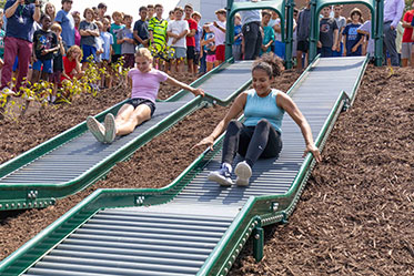 Students racing down two slides while others cheer them on. Links to Beneficiary Designations Students racing down two slides while others cheer them on. Links to Beneficiary Designations
