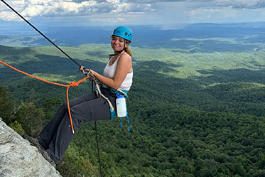 A woman rock climbing. Links to Under Age 45 A woman rock climbing. Links to Under Age 45