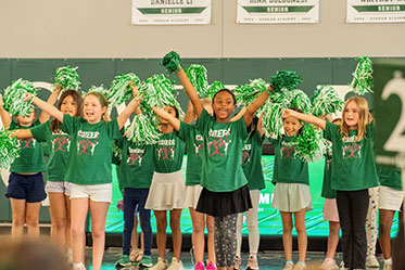 The cheer team performing their routine together. Links to Tangible Personal Property The cheer team performing their routine together. Links to Tangible Personal Property