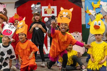 Students happily perform a school play, wearing cute, handmade costumes. Links to Gifts That Protect Your Assets Students happily perform a school play, wearing cute, handmade costumes. Links to Gifts That Protect Your Assets